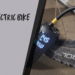 A view of an electric bike pump inserted inside a tire