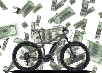 A view of an electric bike with money dollars in the air