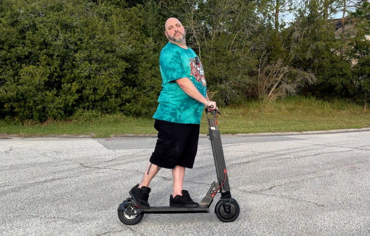 a heavy adult riding on electric scooter for