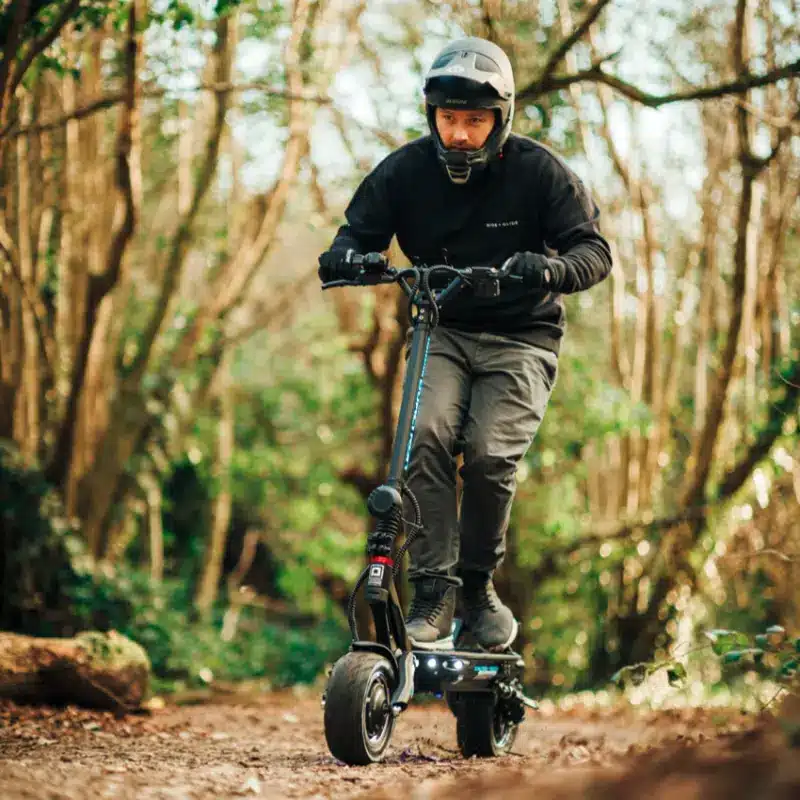 a man riding on his Dualtron Thunder electric scooter