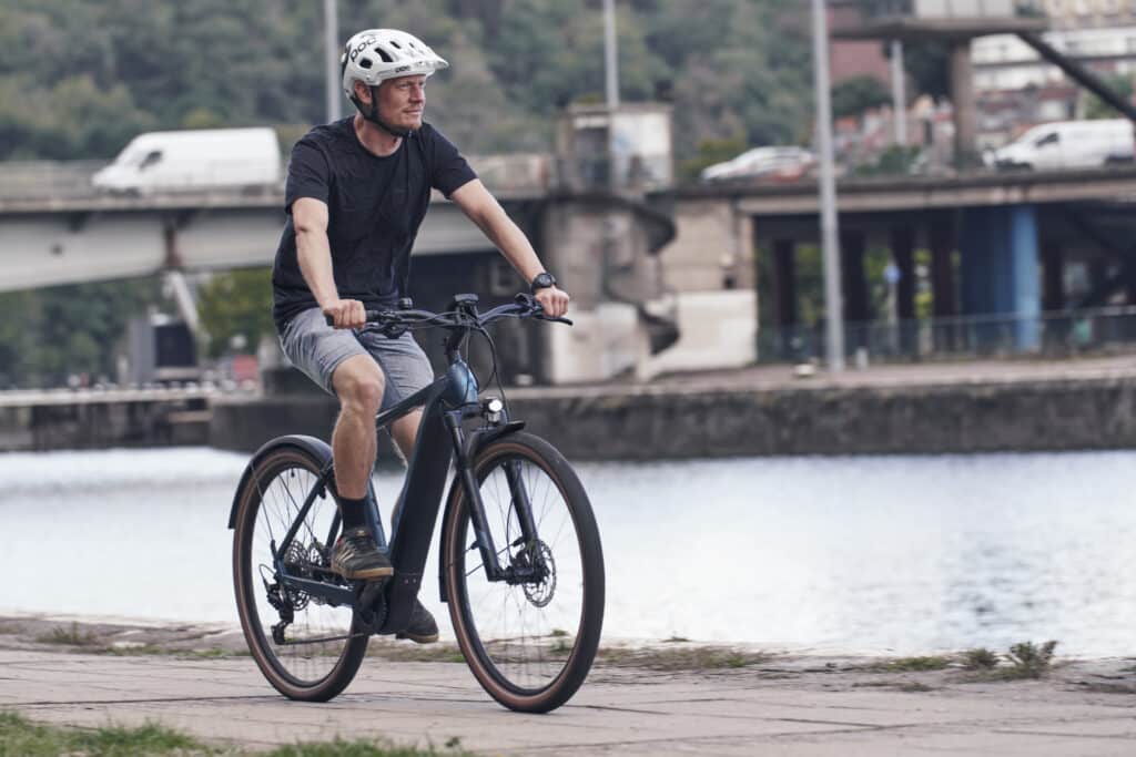 a man riding on his electric commuter bike