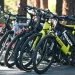 a variety of commuter bikes standing in a row