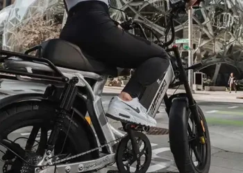 A backview of a woman paddling an e bike