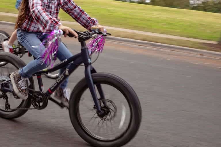 A view of a bike wheel while a paddling it