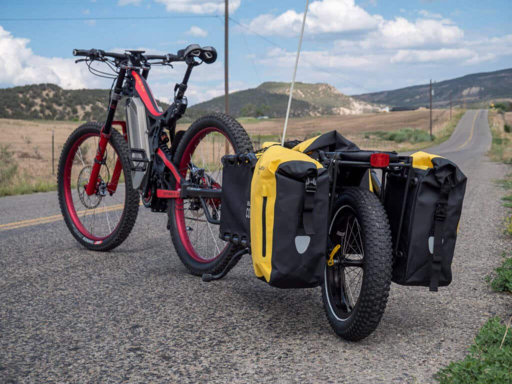 A view of an e bike standing in the middle of the road somewhere far