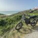 A view of an electric bike standing at a distance grassy place