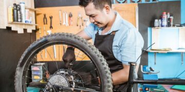A view of a person changing bike tire