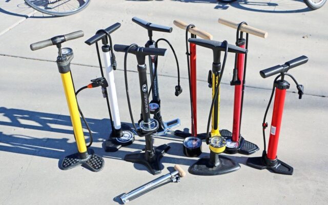 A view of a person pumping a bike tire ( )