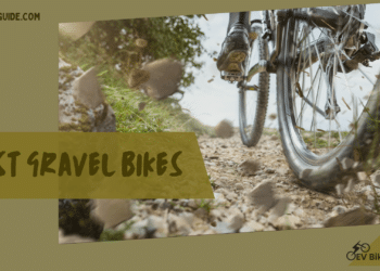 A view of the tires of a gravel bike on gravel road