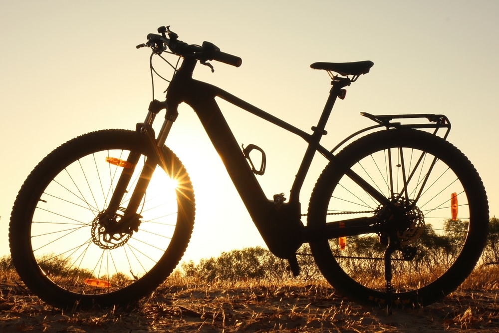 Backlit Ebike In Silhouette At Sunset