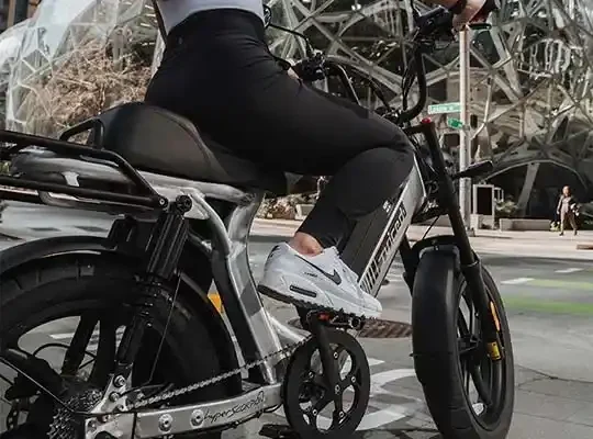 A backview of a woman paddling an e bike