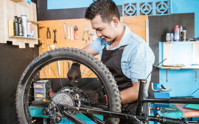 A view of a person changing bike tire