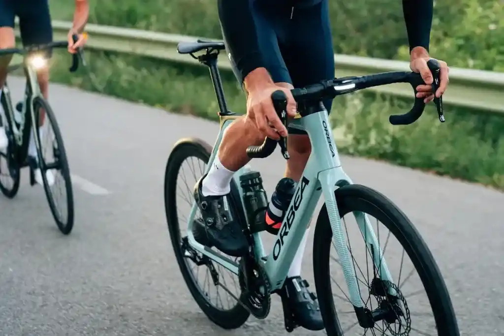 A view of a person paddling an electric road bike on road