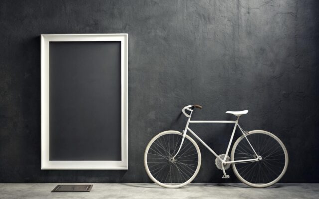 A view of a white bike alongside a white frame